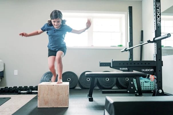 Kid doing box jump